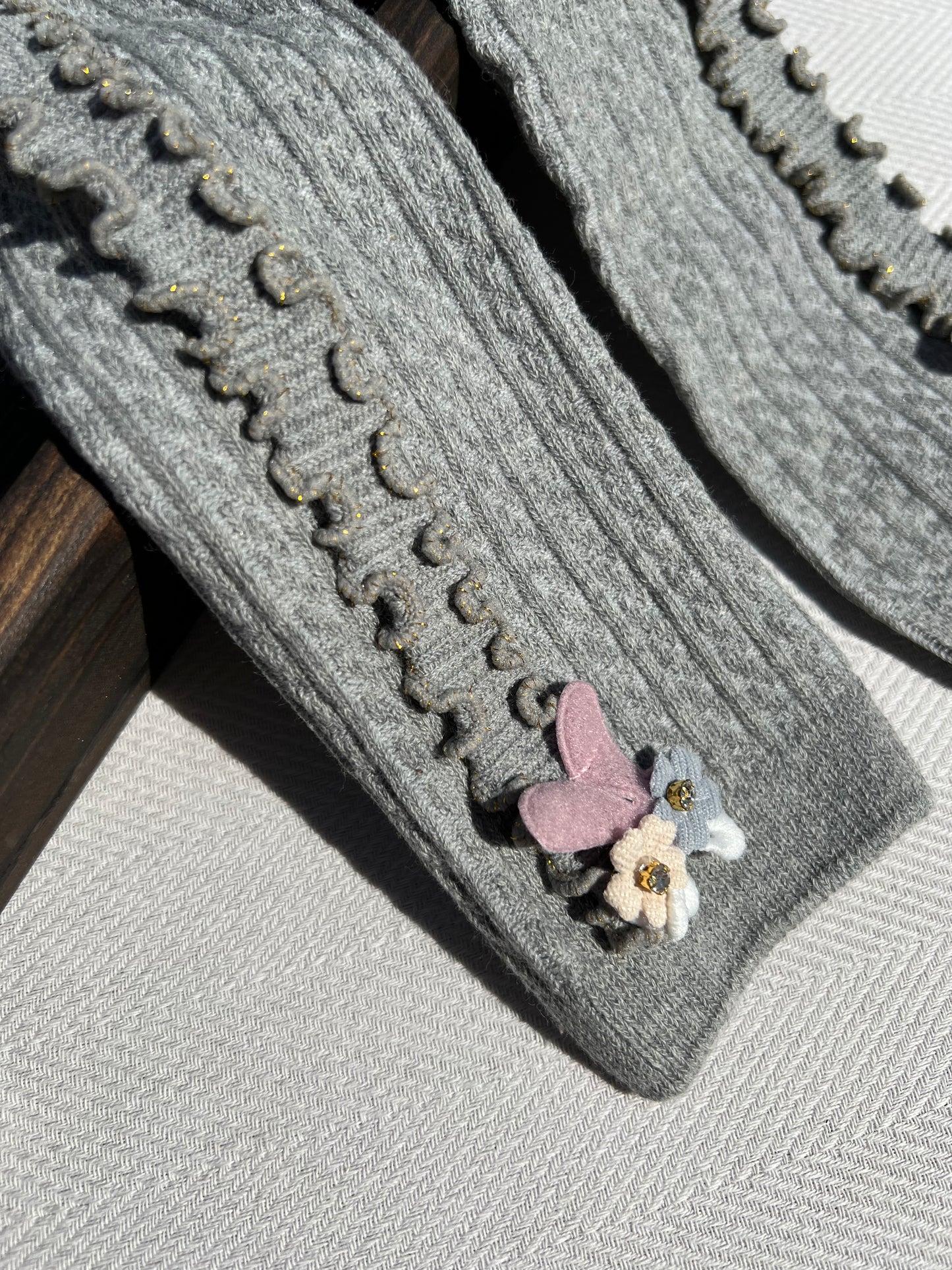 Gray Side Ruffle Ribbed Baby Tights with a Small 3D Cluster of Flowers at the Bottom of Each Leg