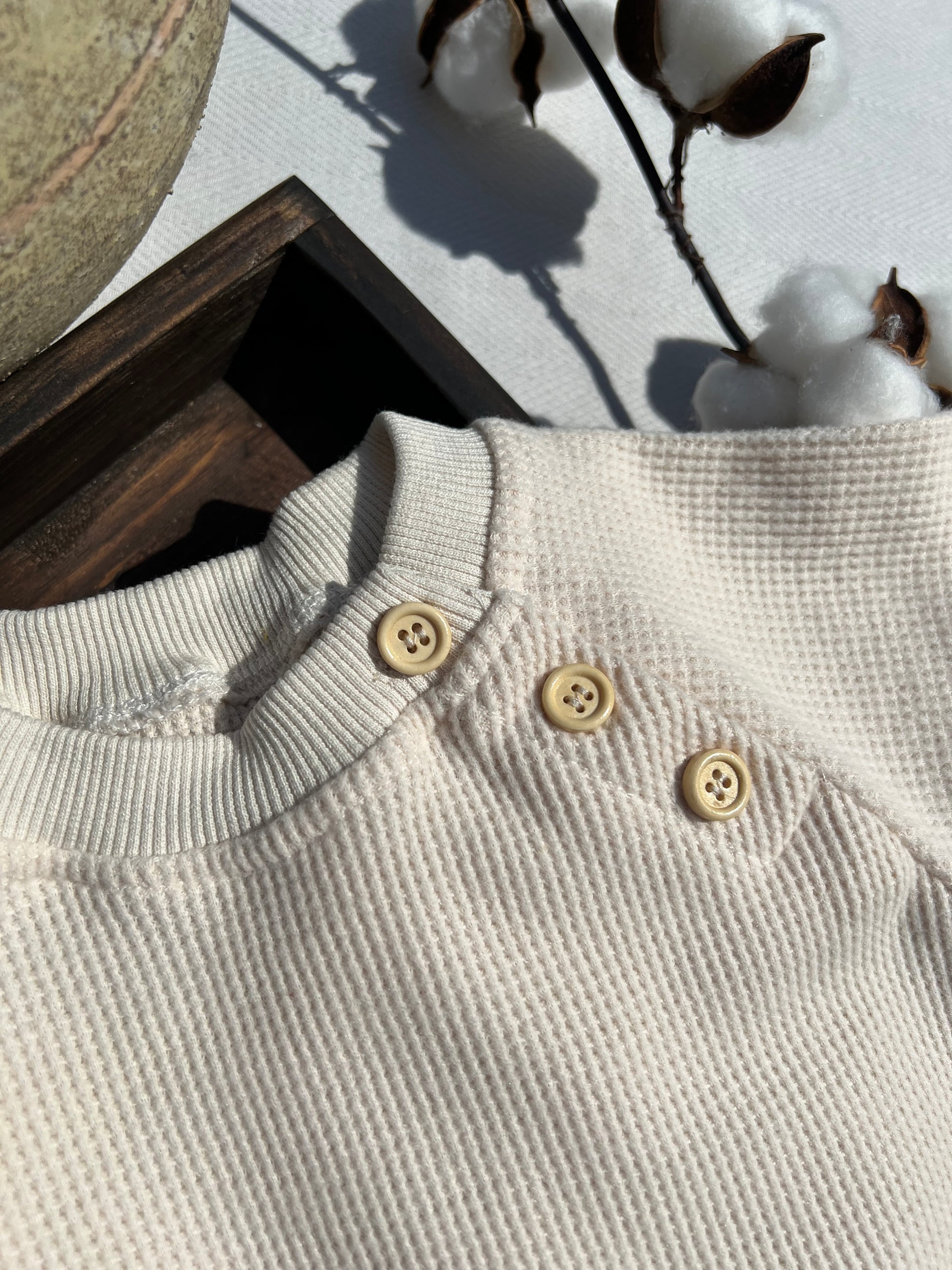 Brown Long Sleeve Waffle Baby Jumpsuit with Three Beige Buttons near Neck