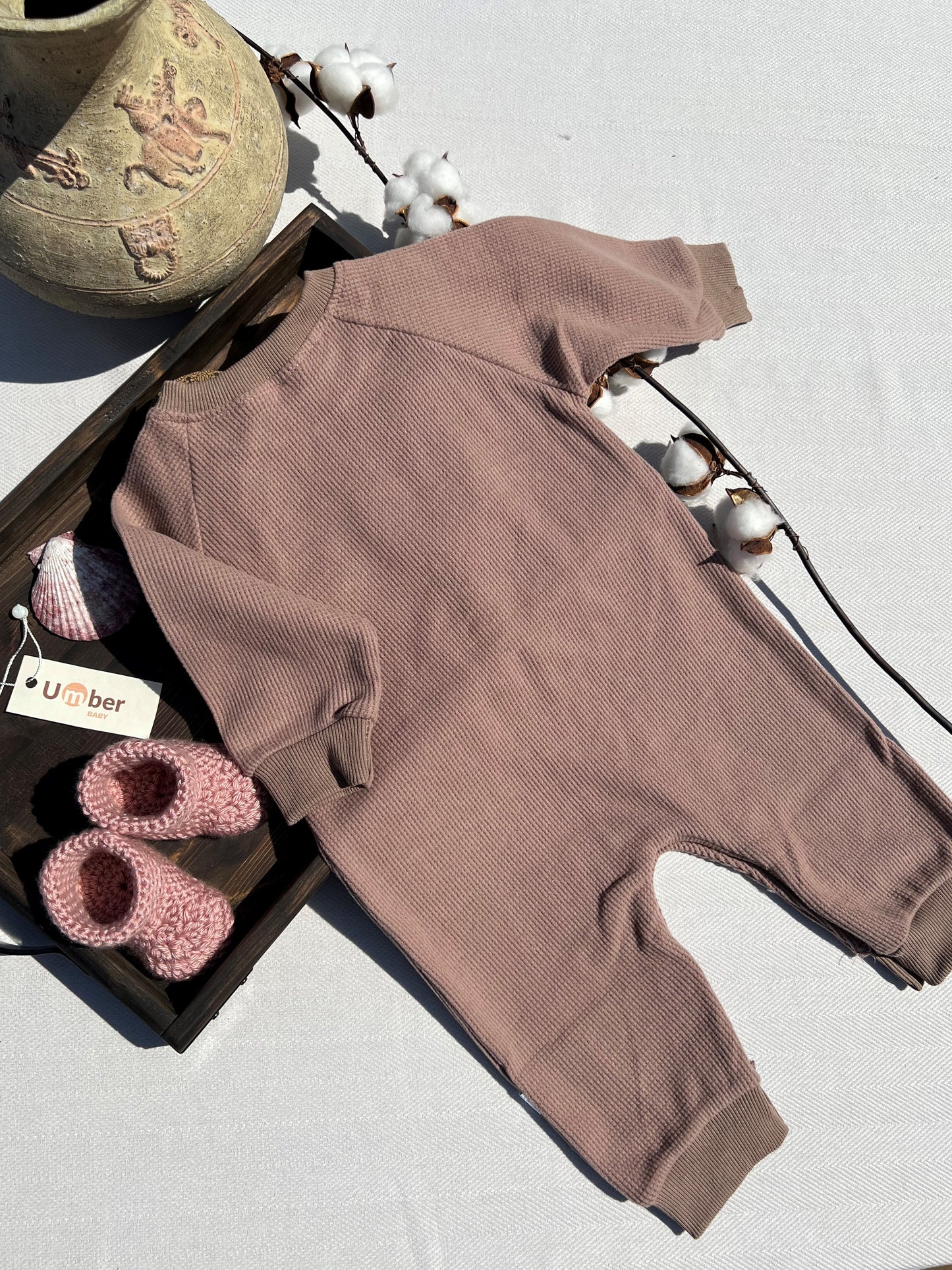 Back of Brown Long Sleeve Waffle Baby Jumpsuit with Snap Leg Closure