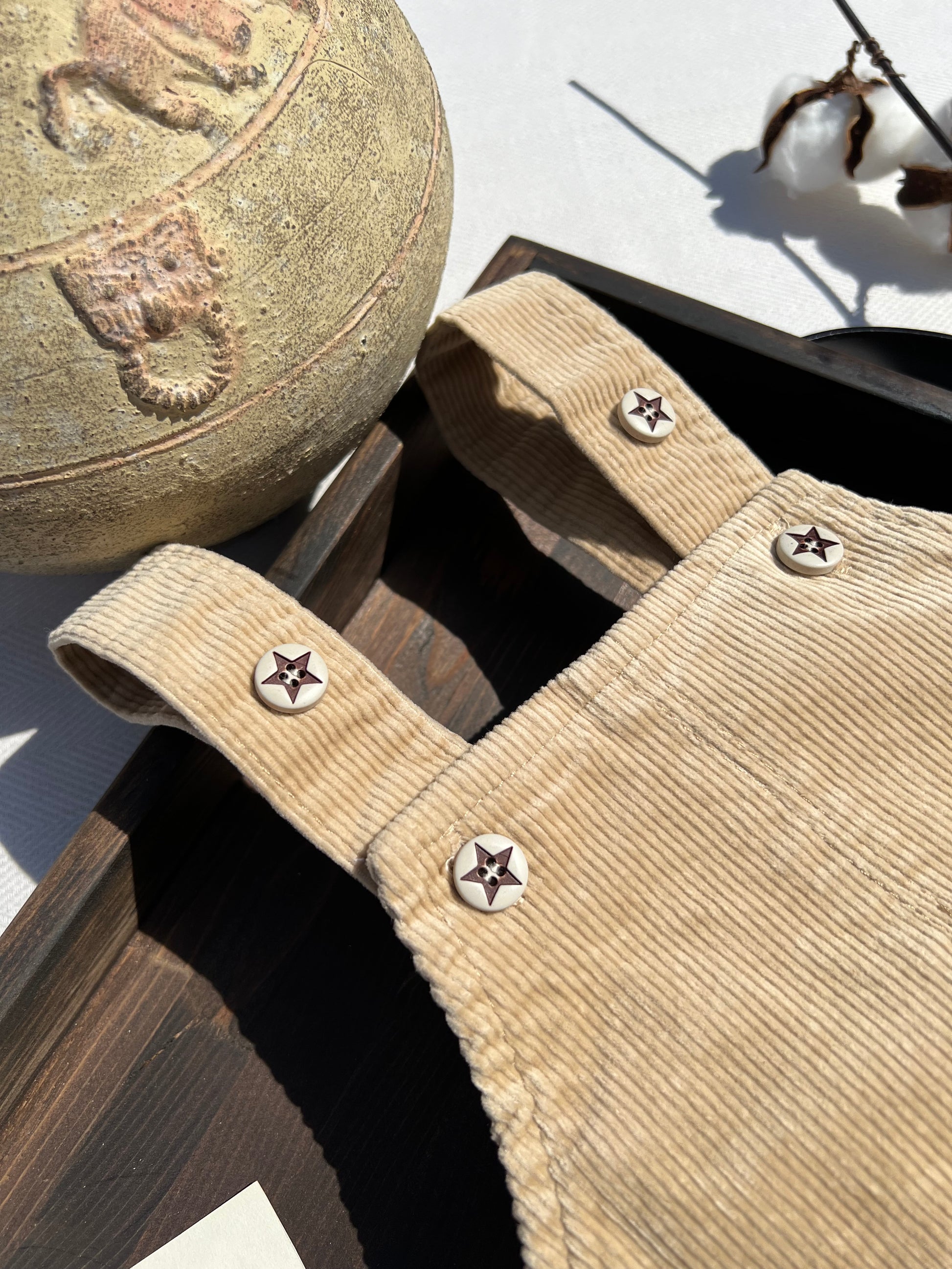 Beige Corduroy Baby Overalls with Adjustable Button-up Straps, Buttons are White with Brown Stars