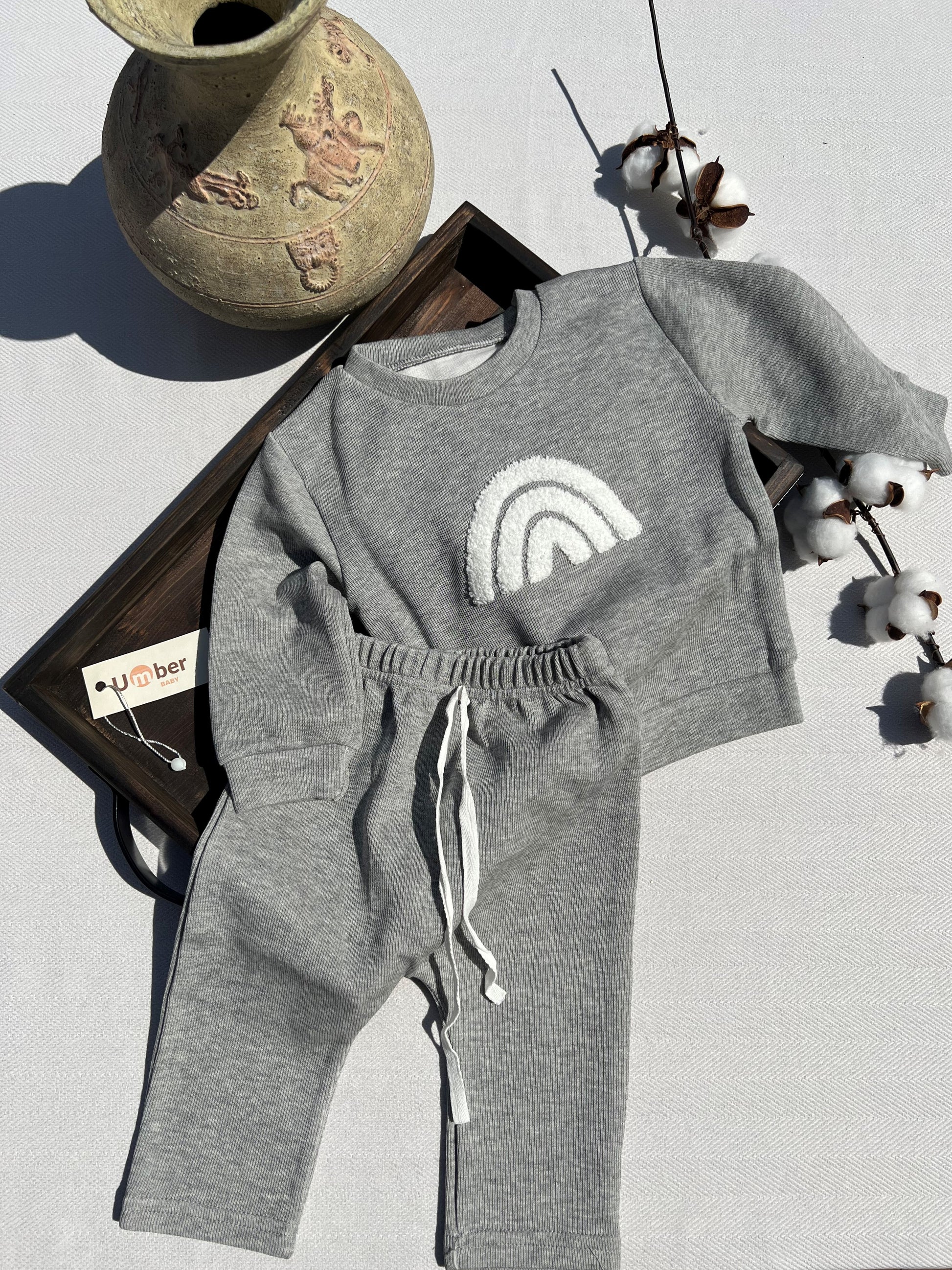 Gray Baby Sweatsuit Set with Long Sleeve Sweatshirt with a White Sherpa Rainbow Design and Matching Gray Sweatpants with non-adjustable White Tie Strings