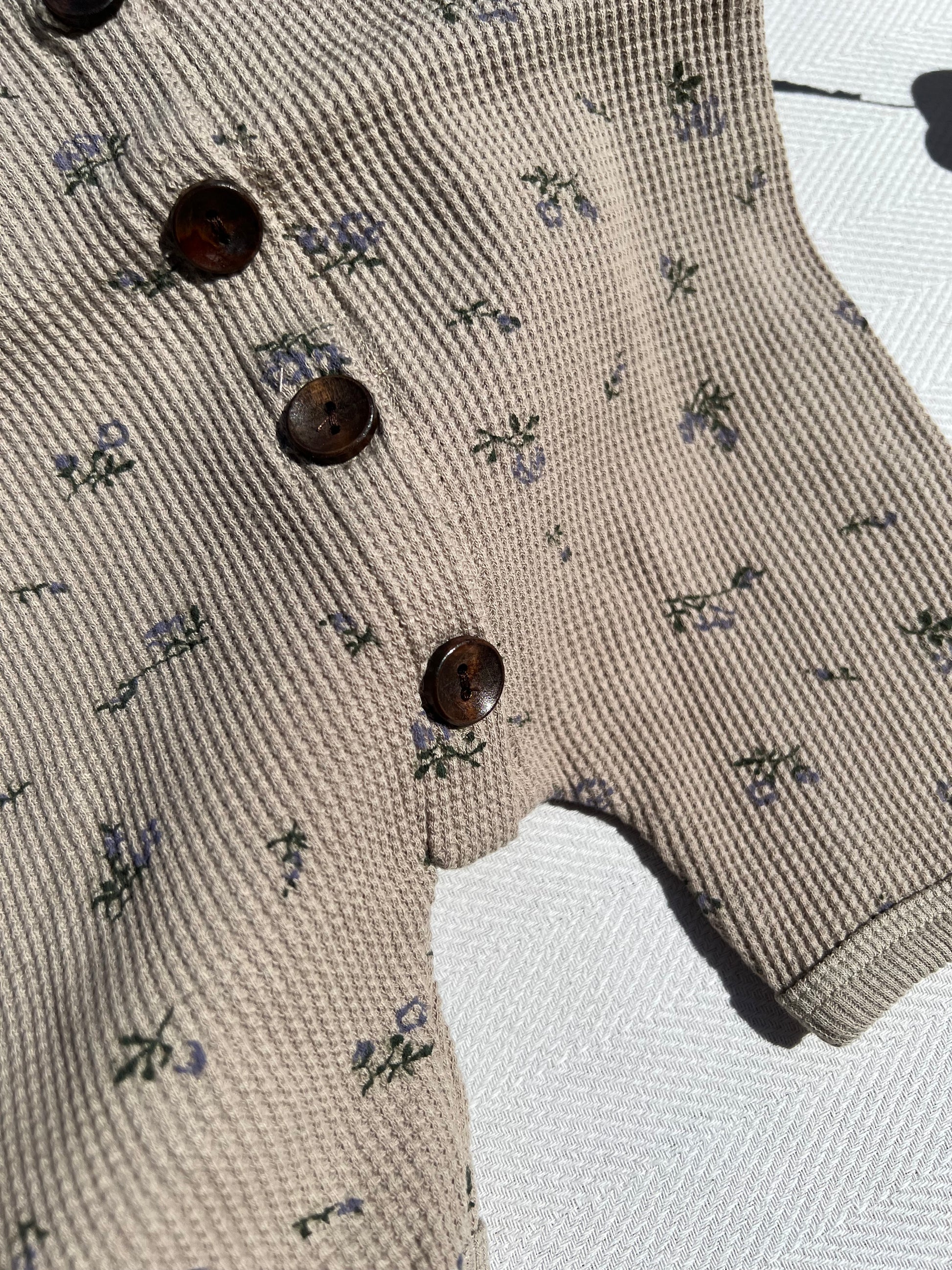 Taupe Short Sleeve Waffle Baby Romper with Small Purple Flower Pattern and Dark Brown Buttons