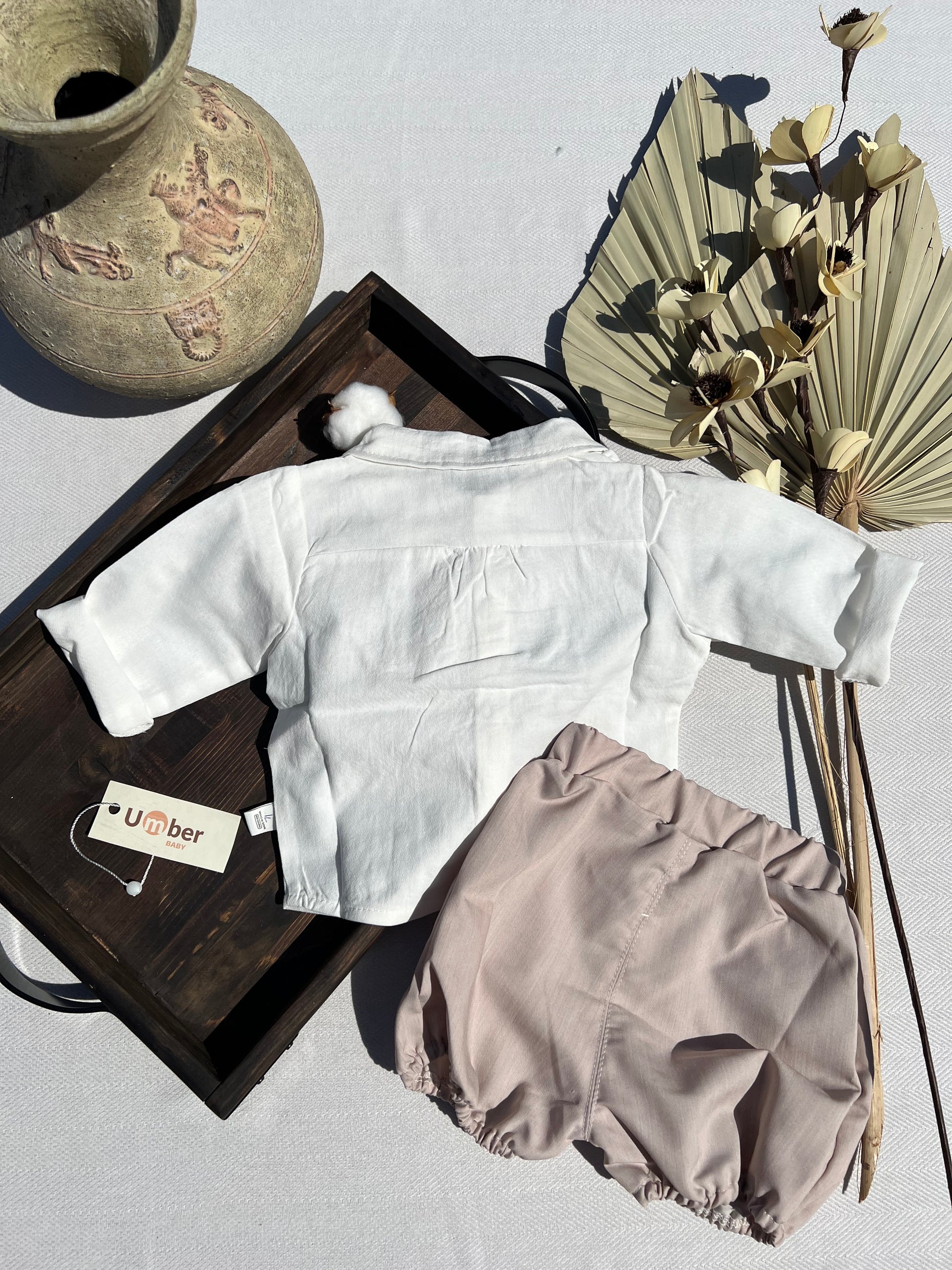 Back of Formal Baby Three Piece Set with White Button-up Dress Shirt, Latte Colored Shorts, and Matching Bow Tie