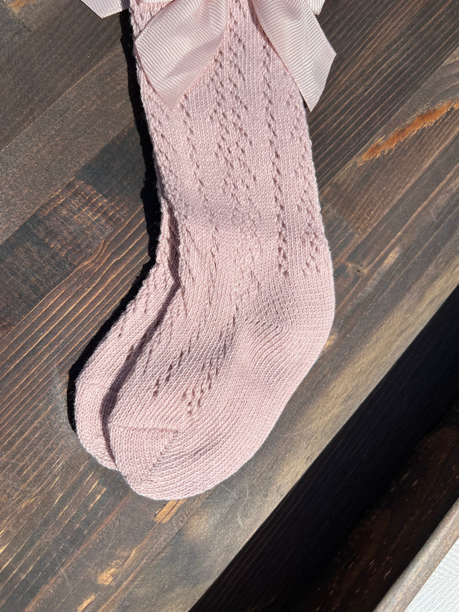 Pink Knee High Baby Socks with a Bow at the Top